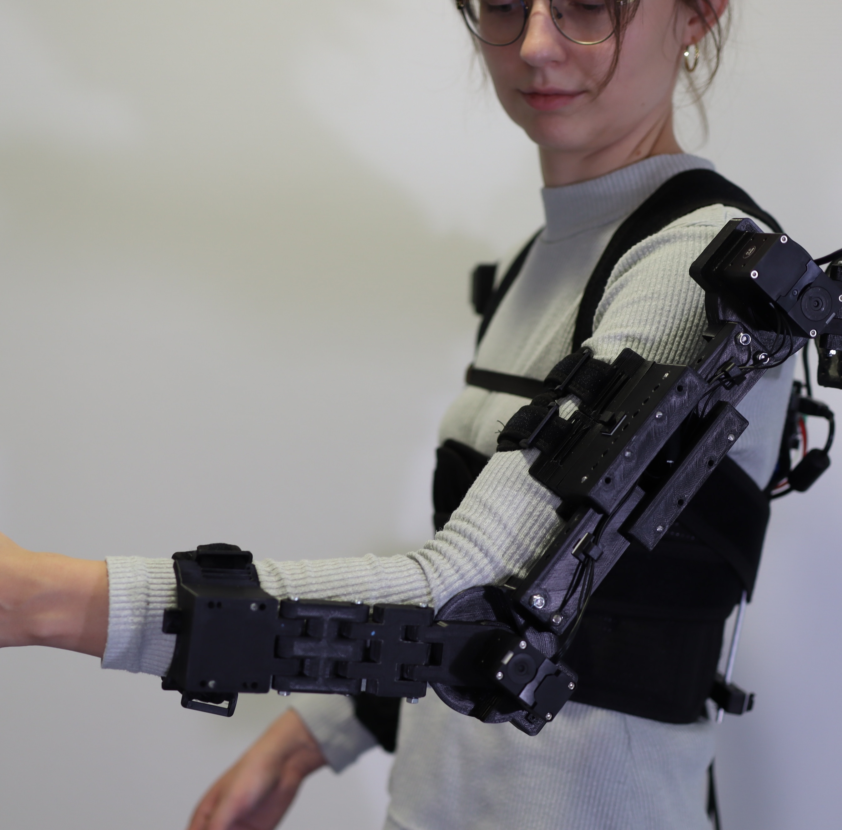 Photo of a woman wearing the exoskeleton prototype.